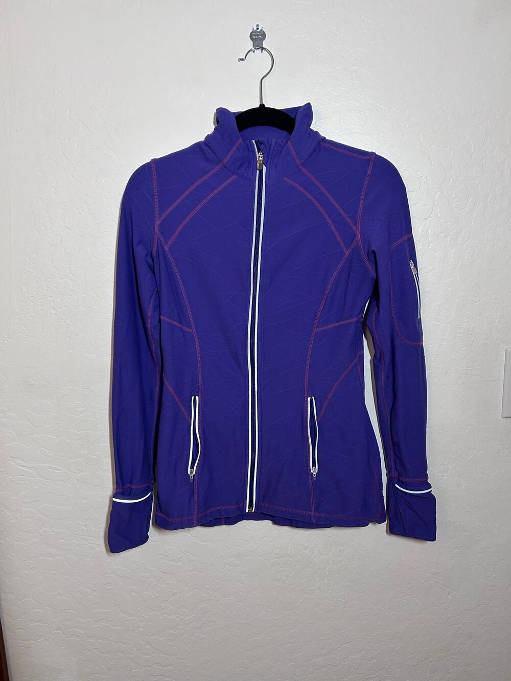 Women’s full zip athletic purple longline running jacket with reflective lining